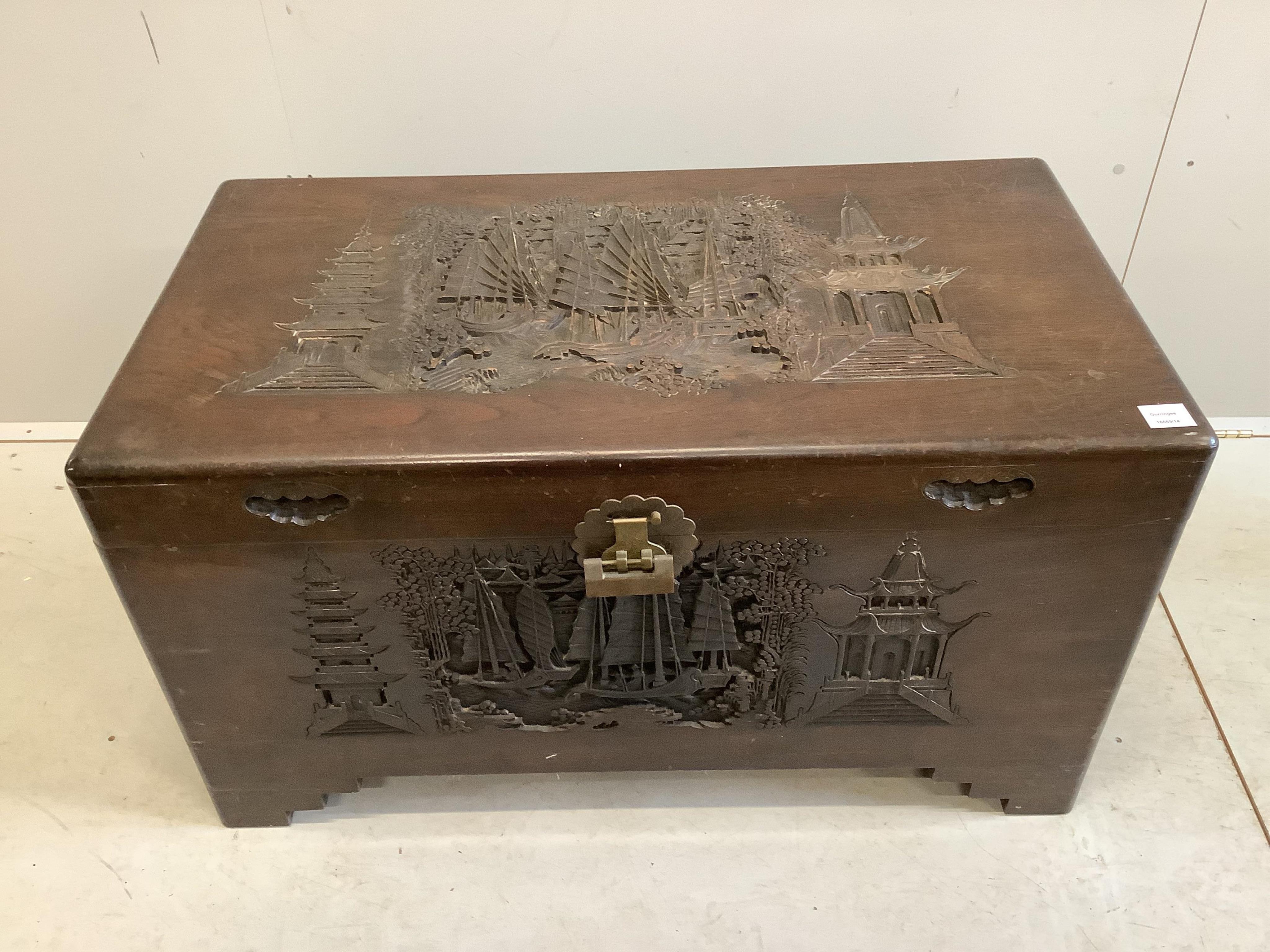 A Chinese carved camphorwood trunk, width 100cm, depth 55cm, height 57cm. Condition - fair